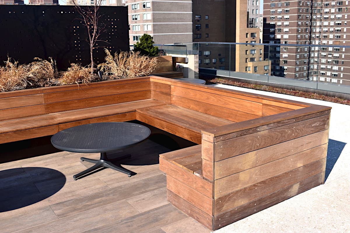 Built-in Ipe seating surrounding a rooftop lounge