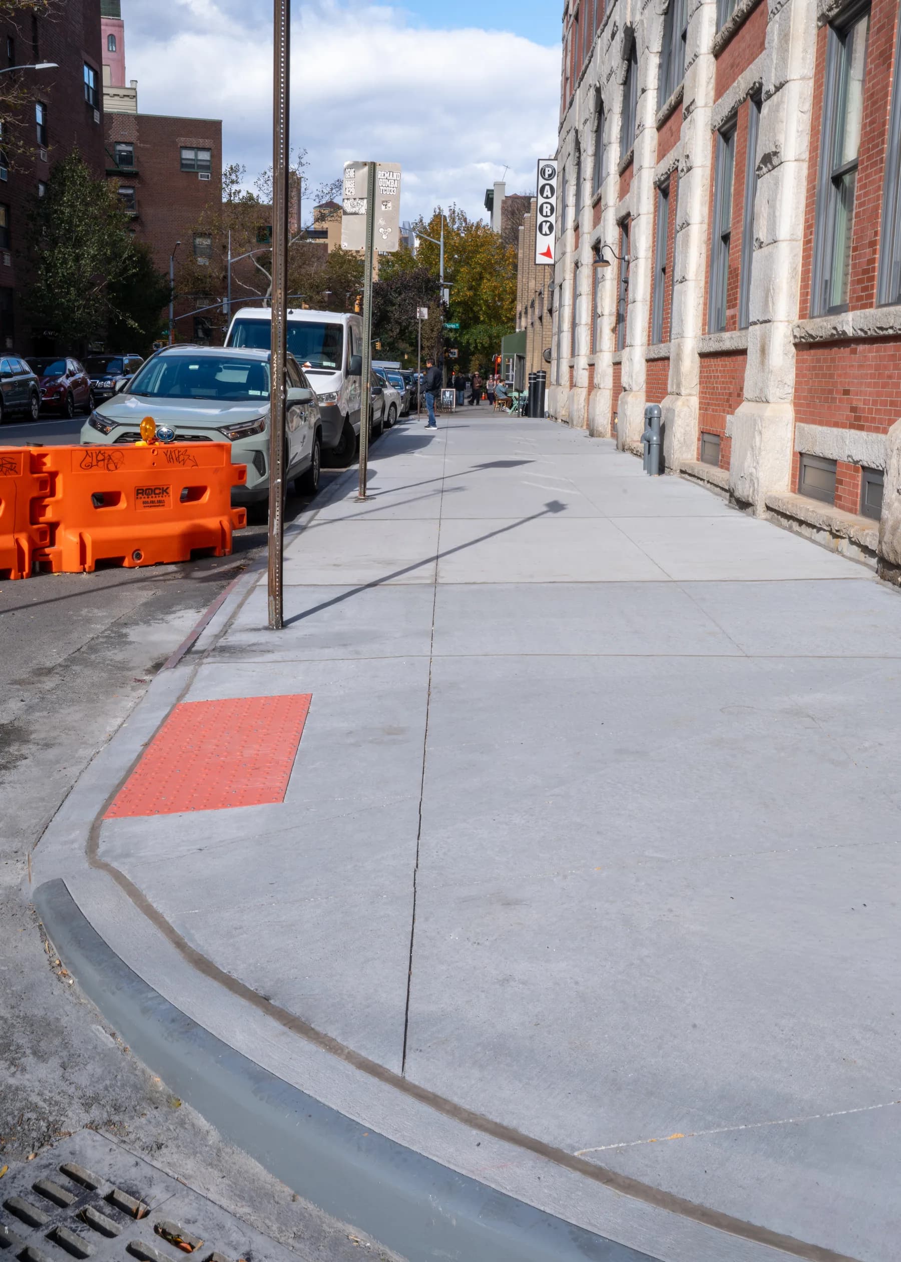 New sidewalk leading toward the accessible curb ramp
