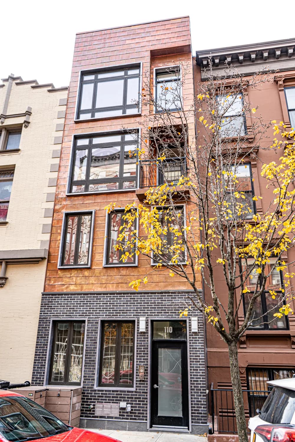 Full street elevation with copper cladding and balcony