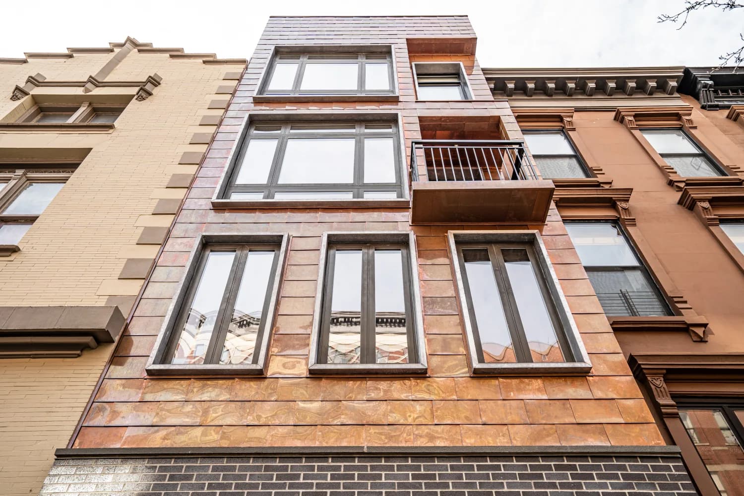 Completed copper façade and projecting balcony