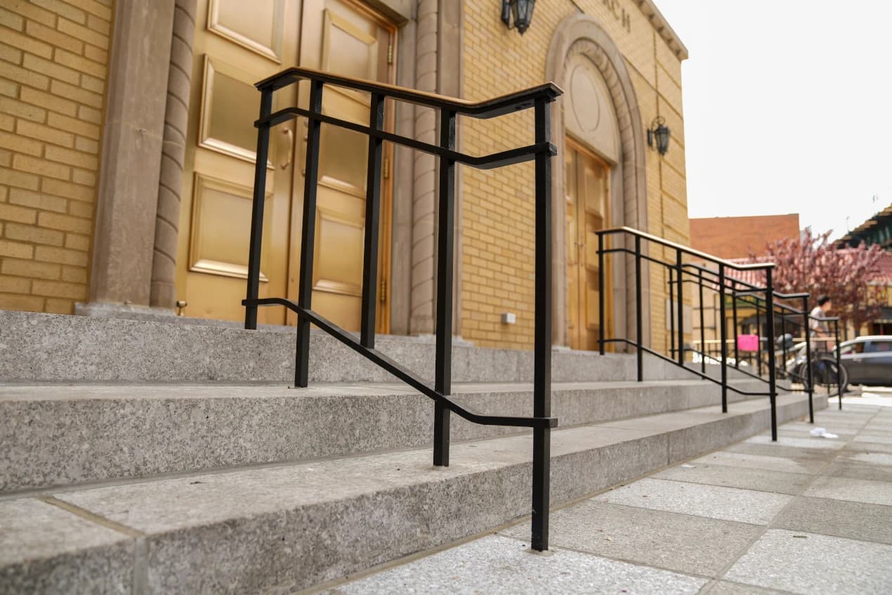 Completed granite steps and custom entrance railings